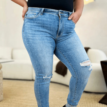 Full view of cuffed skinny jeans showing the flattering fit.