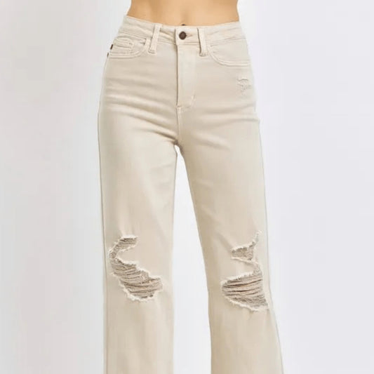Front view of distressed wide-leg jeans in bone wash.