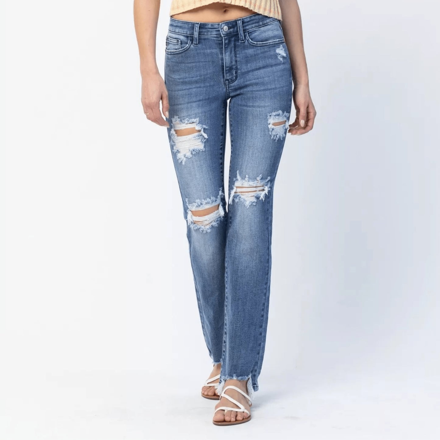 Model wearing Judy Blue distressed straight leg jeans and a yellow striped shirt.