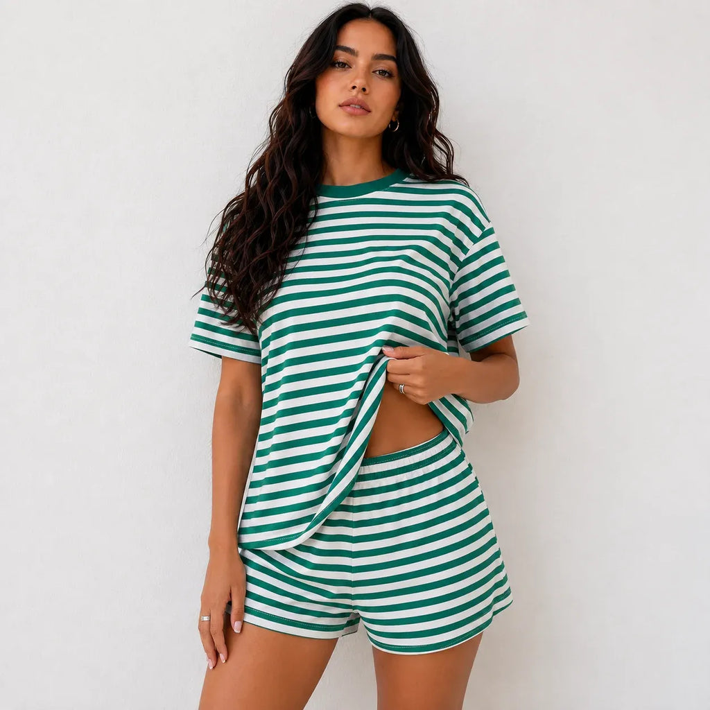Woman wearing emerald green and white horizontal striped short-sleeve top and shorts lounge set