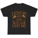 Black graphic t-shirt featuring the "Excuse Me You Look Like You Love Me" western-inspired graphic with cowboy hats and guitars.