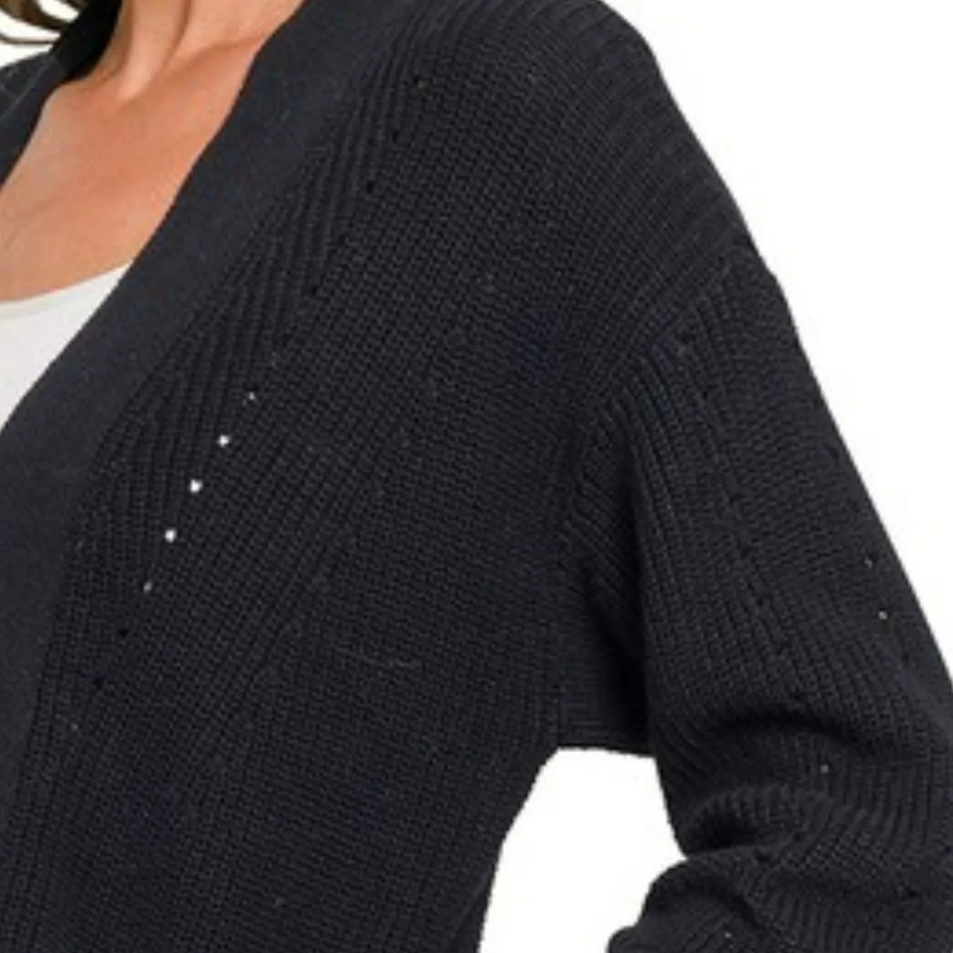 Detailed view of the feminine eyelet knit and ribbed trim on the black Zenana cardigan.