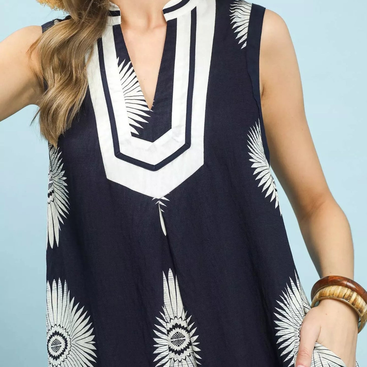 Texture shot of the premium navy geometric pattern fabric on an Umgee midi dress from Solazura Boutique