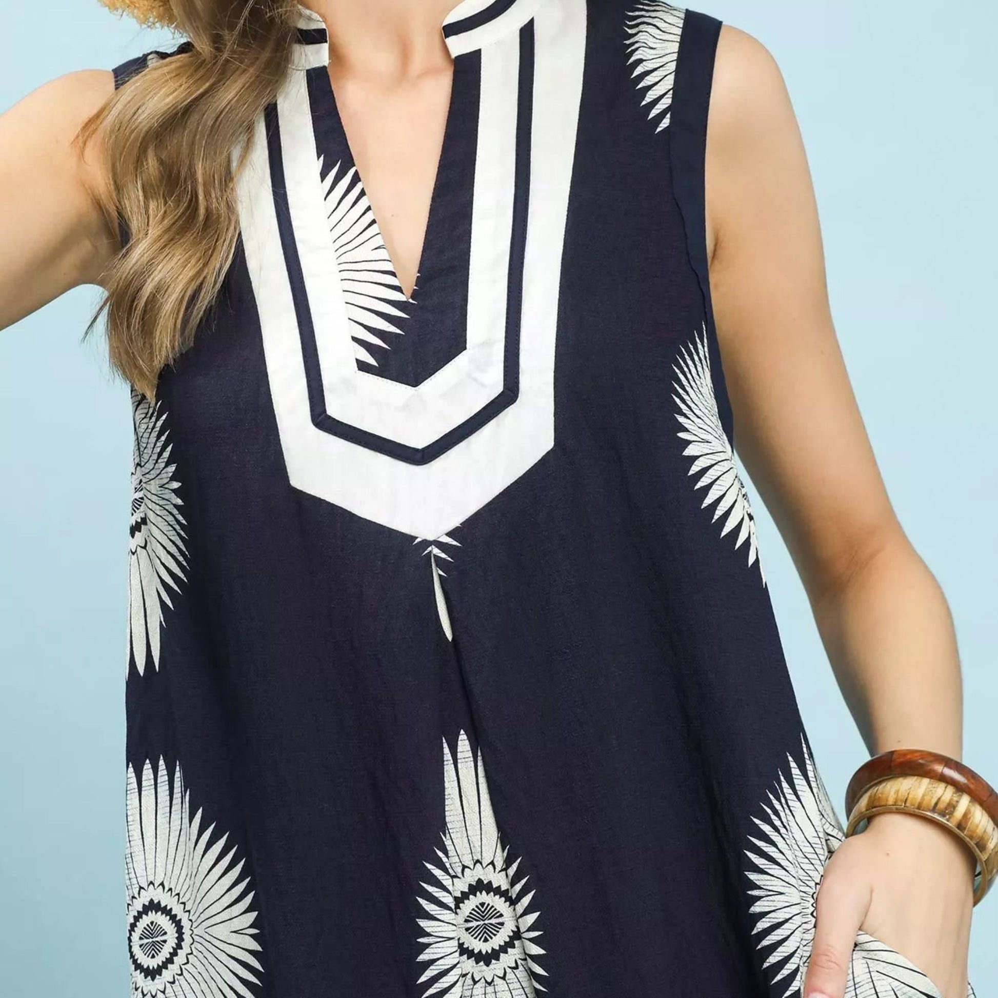 Texture shot of the premium navy geometric pattern fabric on an Umgee midi dress from Solazura Boutique