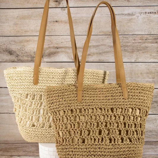Front view of the Fame intricate straw braided large tote bag in Khaki with brown handles.