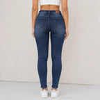 Fleece-lined mid-rise skinny jeans in blue shown from the back