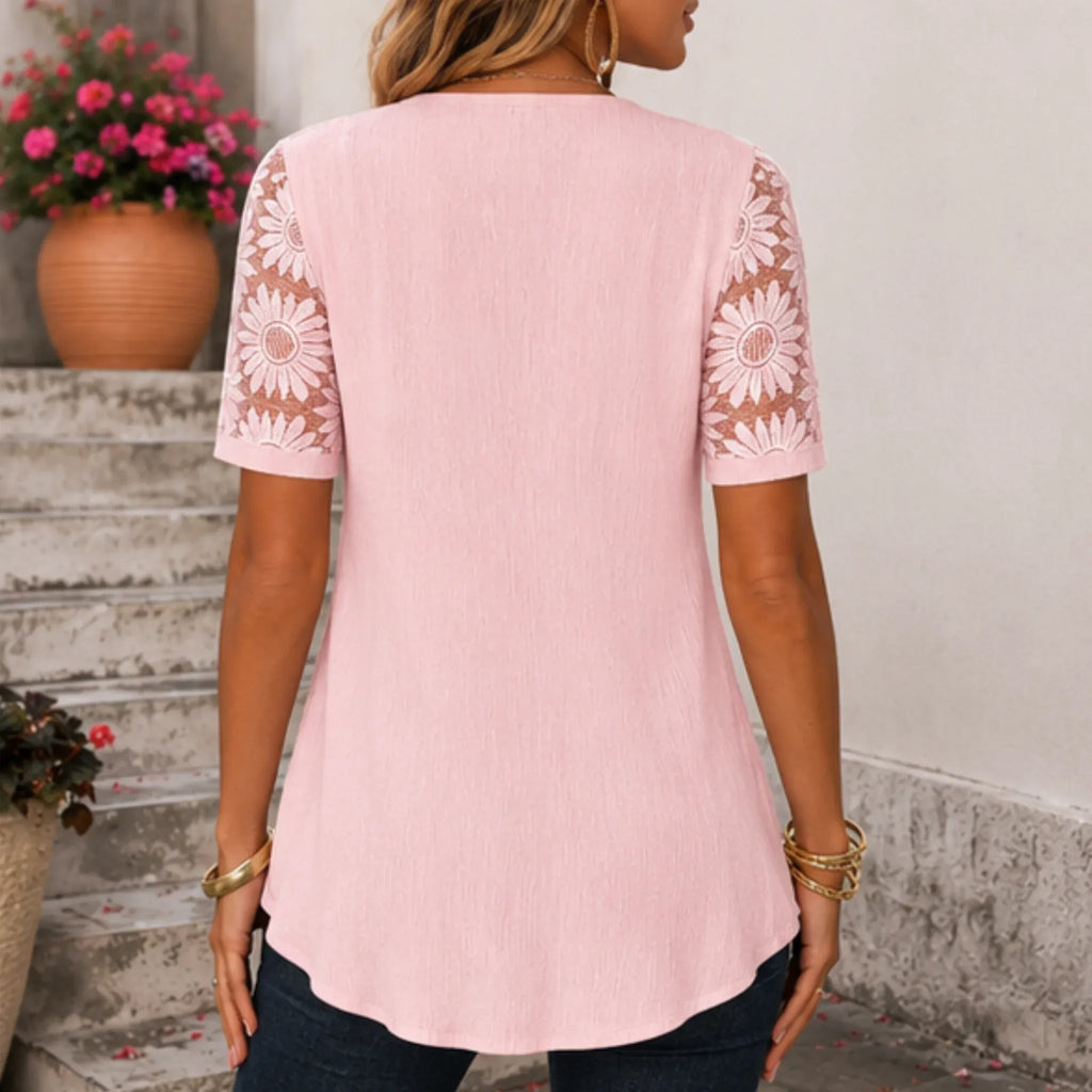 Women's pink floral lace mesh hollow-out faux layered short sleeve boutique top back view.