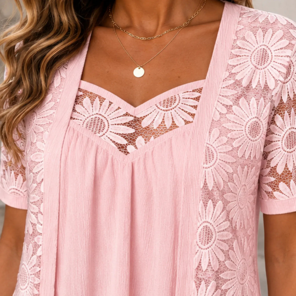 Close-up of the pink floral lace mesh hollow-out sweetheart neckline and lace detail on the women's boutique top.