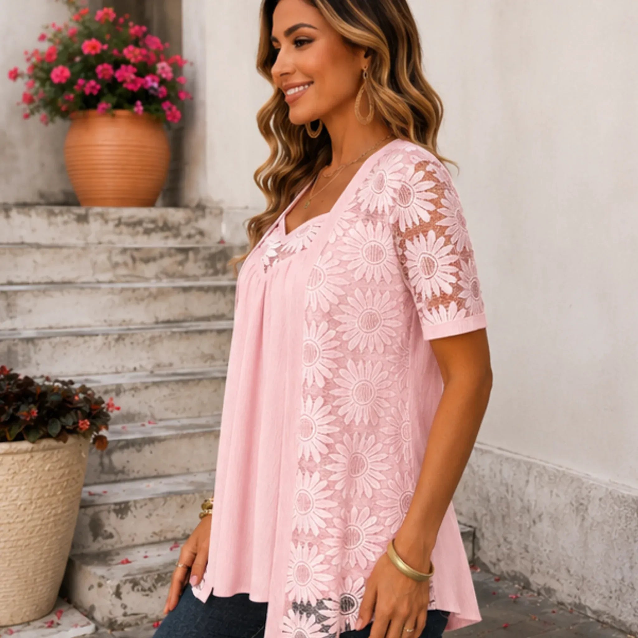 Women's pink floral lace mesh hollow-out faux layered short sleeve boutique top side view.