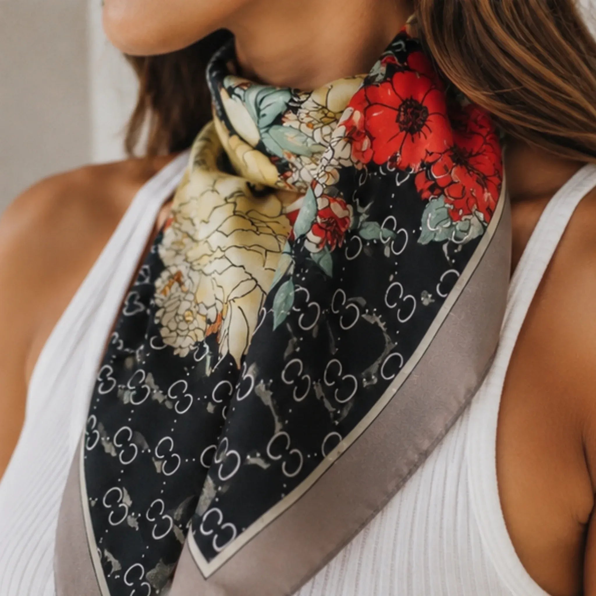 Close-up of the Women's Floral Printed Bandana Scarf in Black featuring the floral print, silky texture, and lightweight fabric.