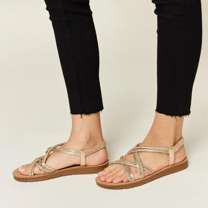 Side profile of the Forever Link rhinestone flat sandals showcasing the low 0.7-inch heel.