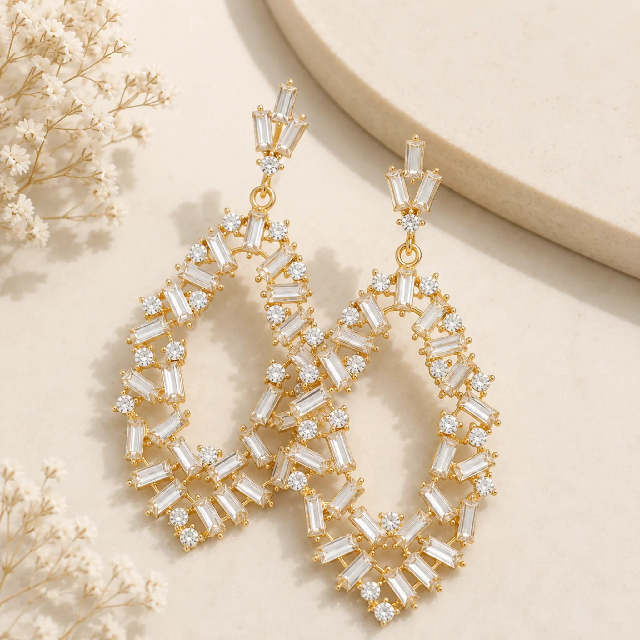 gold-rhinestone-drop-earrings-baguette-crystal-flat-lay-solazura-boutique.webp