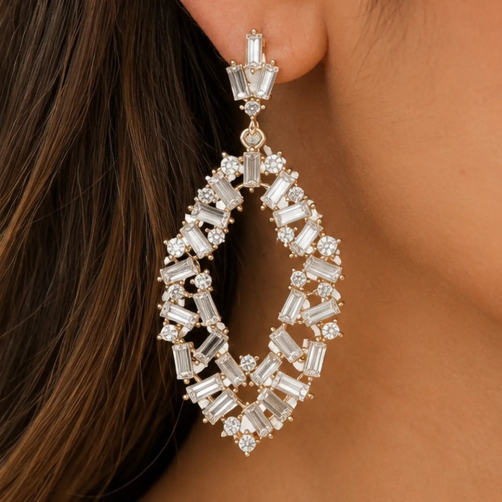 gold-rhinestone-drop-earrings-close-up-baguette-crystals-solazura-boutique.webp