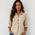 Women's beige linen blend button-front blouse with collared neckline, wooden buttons, and relaxed fit.