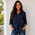Women's navy blue linen blend button-front blouse with collared neckline, rolled sleeves, and relaxed silhouette.