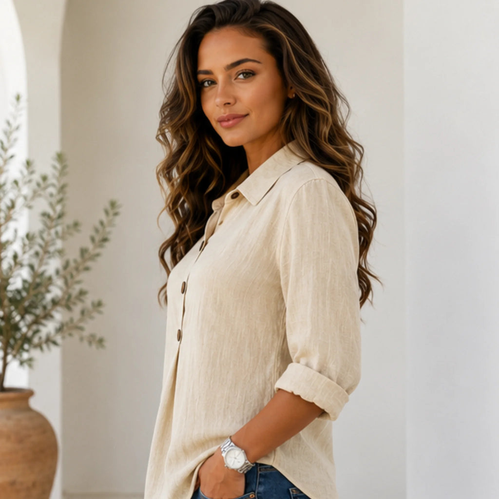 Side view of women's beige linen blend collared button-front blouse with rolled sleeves and relaxed silhouette.