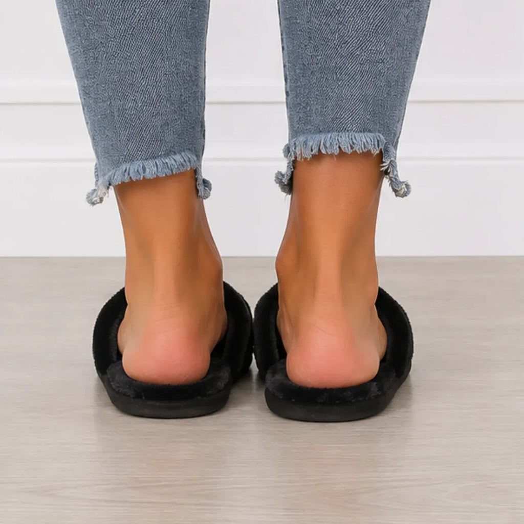 Back view of black Heart Plush House Slippers with soft faux fur lining and open-back indoor slide design.