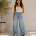Front view of women's high rise wide leg jeans in light wash denim with a flattering high waist, relaxed silhouette, and full-length wide leg design.