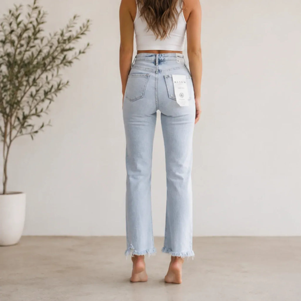 Back view of Women's High Waist Distressed Straight Leg Jeans in light blue with classic five-pocket styling and frayed hems.