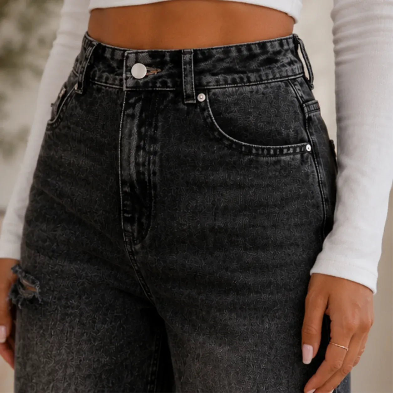 Close-up of High Waist Distressed Wide Leg Black Jeans highlighting the premium denim fabric, high-waist construction, and classic pocket detailing.