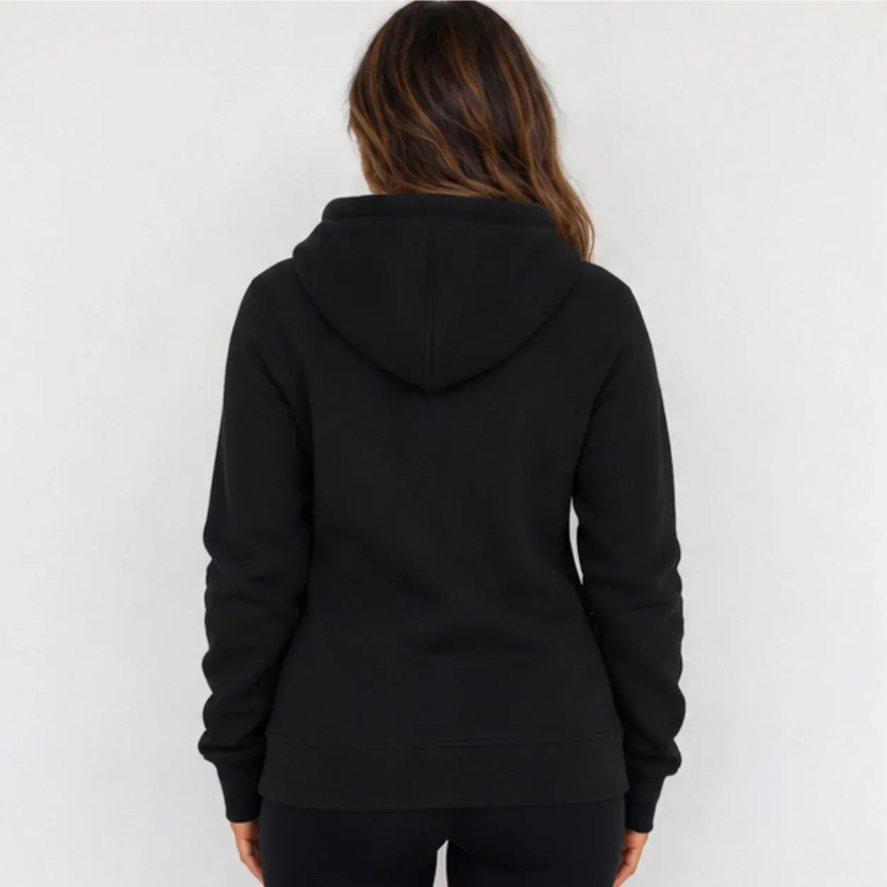 Back view of women's black hooded fleece-lined zip-up sweatshirt with hood and long sleeves