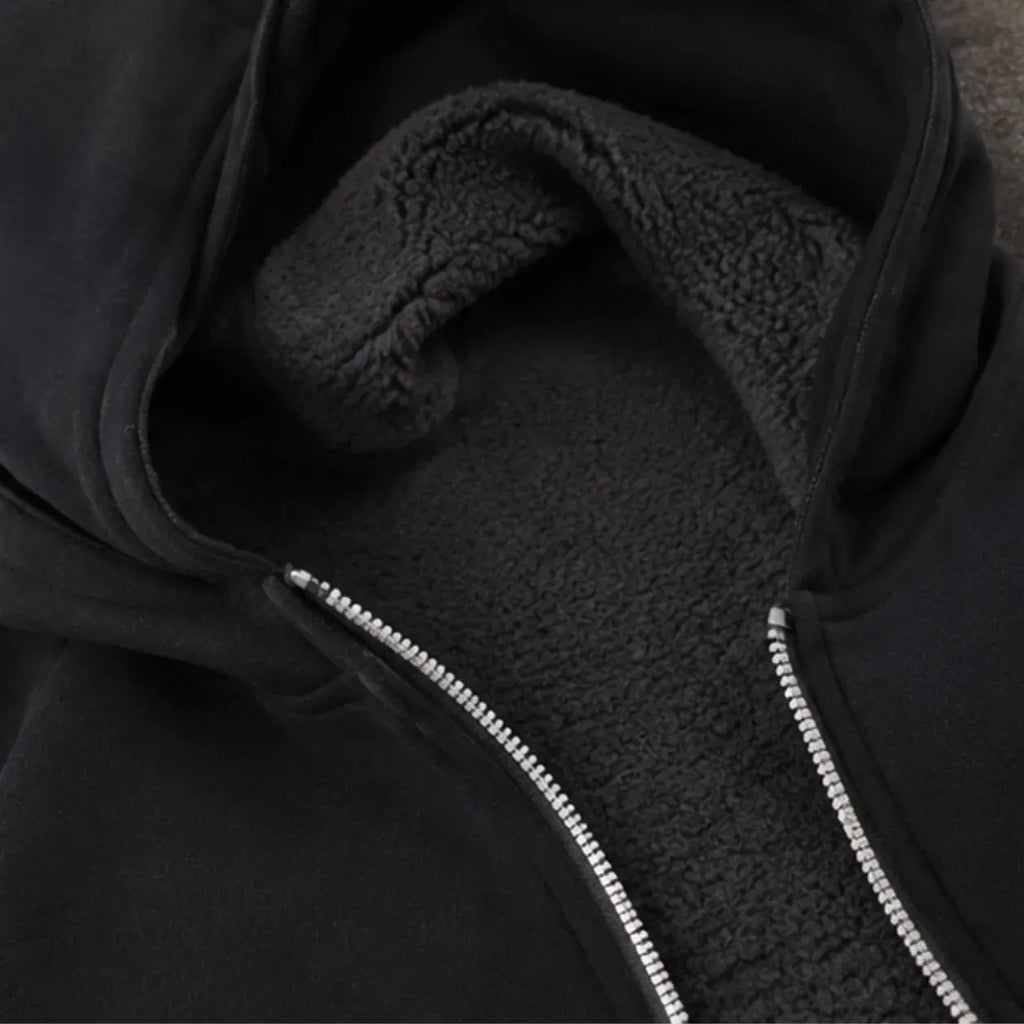 Hooded fleece-lined zip-up sweatshirt showing soft fleece interior lining and zipper detail