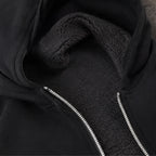 Hooded fleece-lined zip-up sweatshirt showing soft fleece interior lining and zipper detail