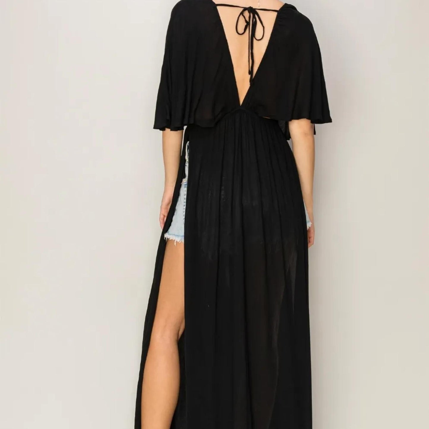 Detailed view of the backless design and tie closure on the HYFVE Black maxi.