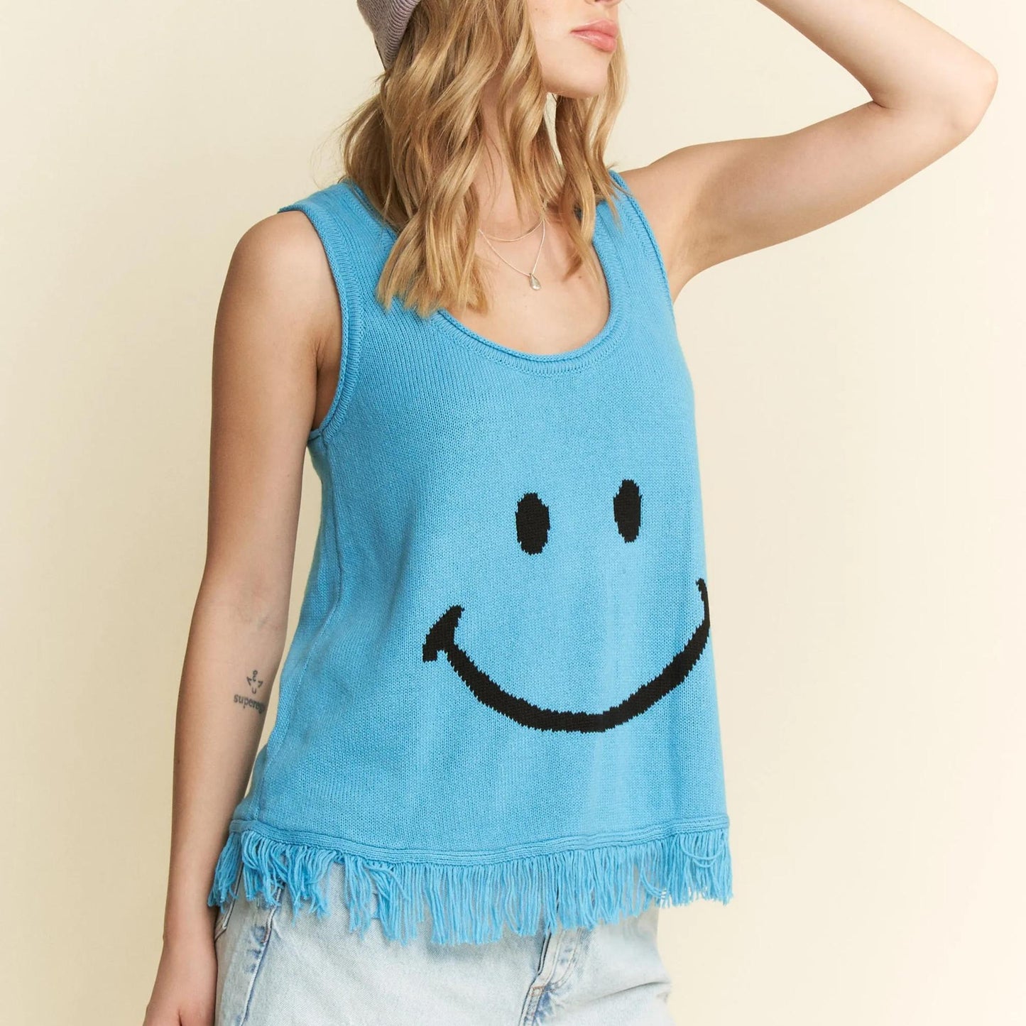 Final model view of the Jade By Jane turquoise sleeveless fringe top.