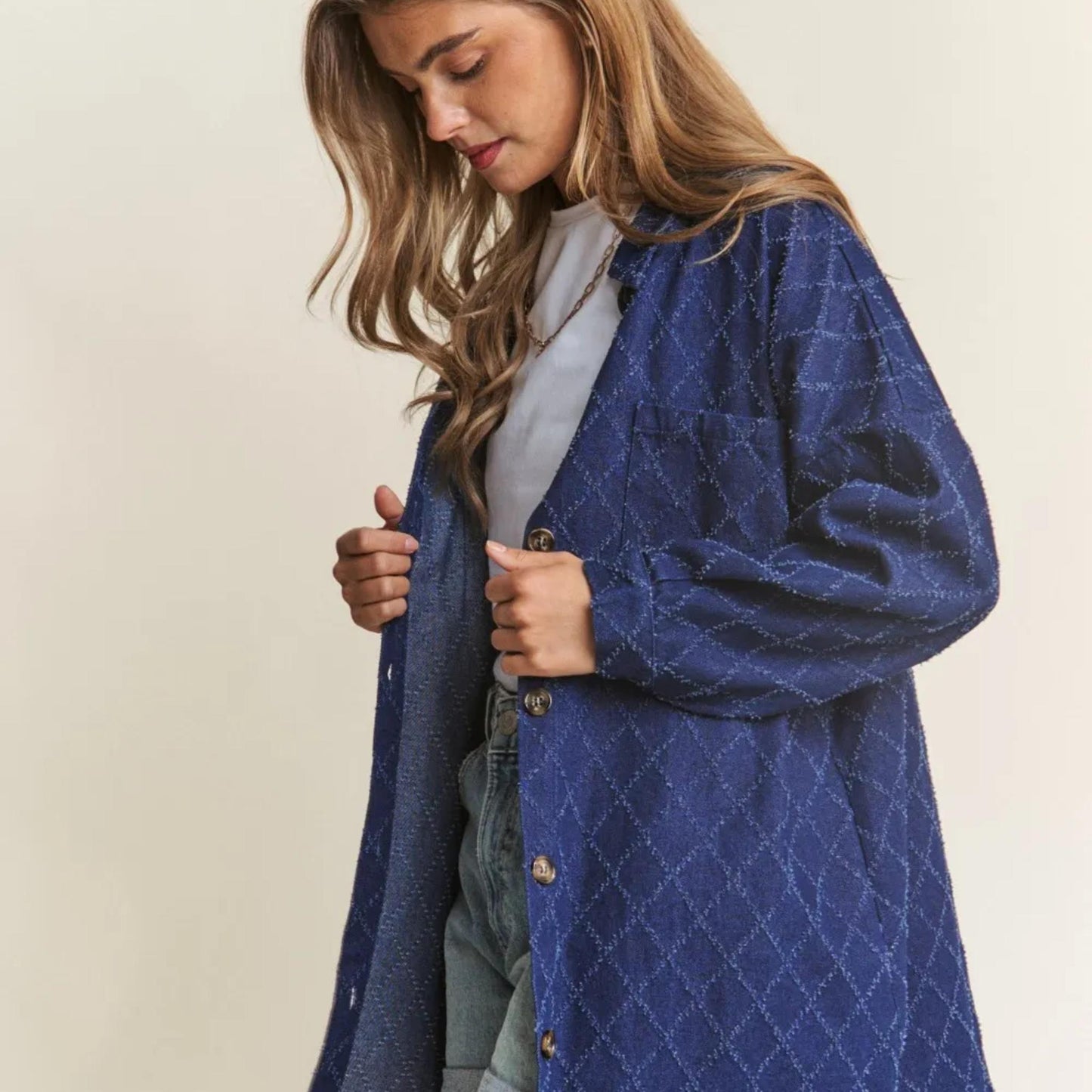 Close-up view of the unique rhombus stitching pattern on the J.NNA denim jacket.