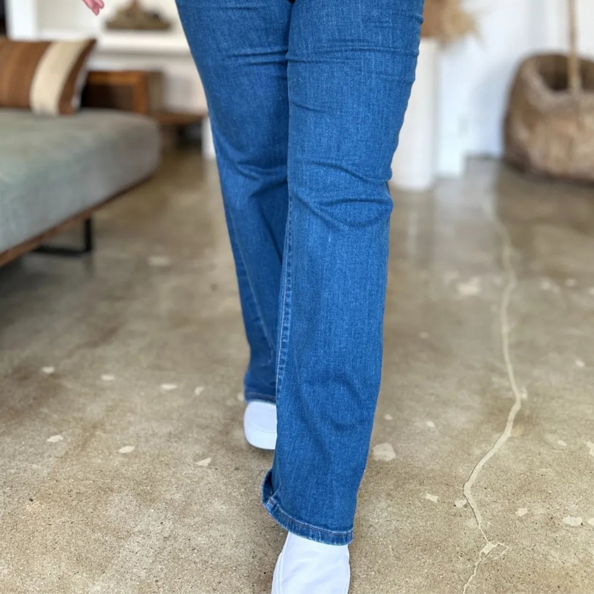 Full view of the Judy Blue high-rise straight jeans in a lifestyle setting.