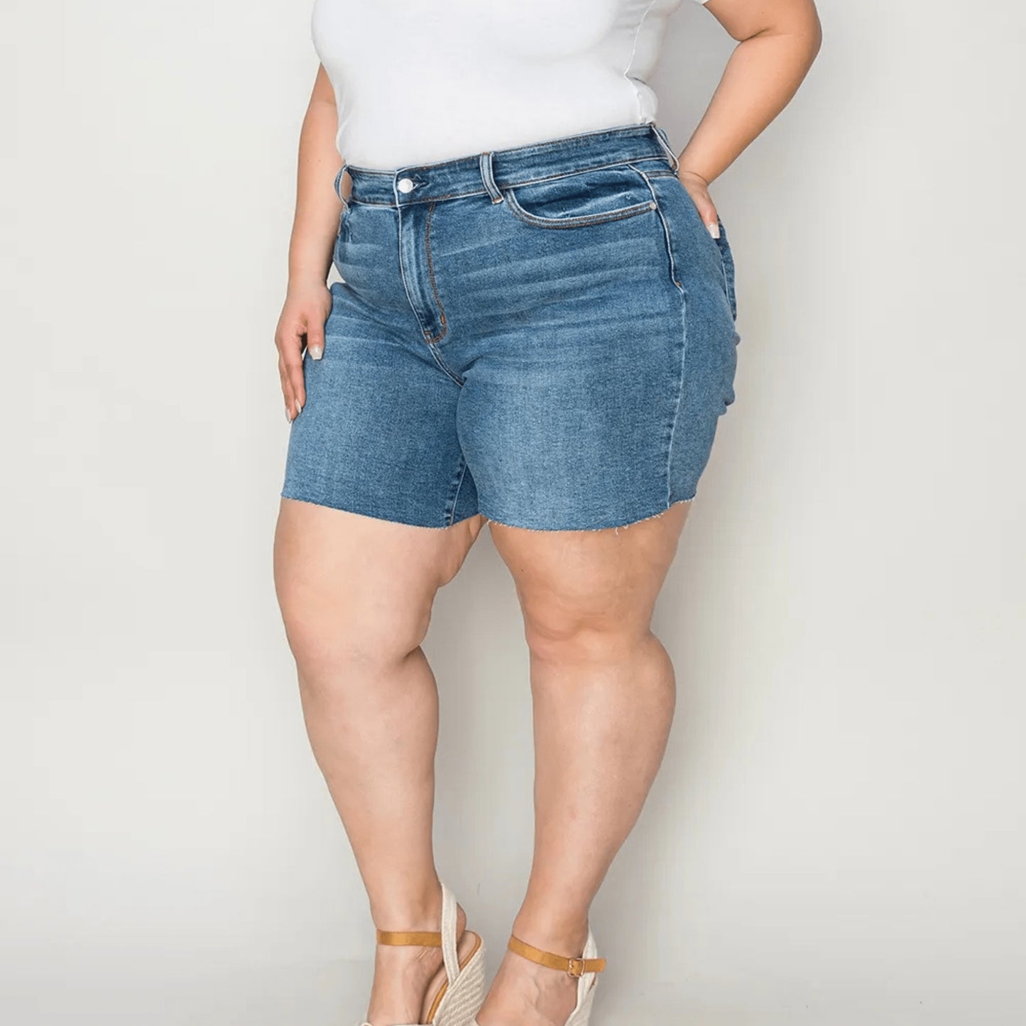 Full styling view of Judy Blue high-waist shorts and white top.