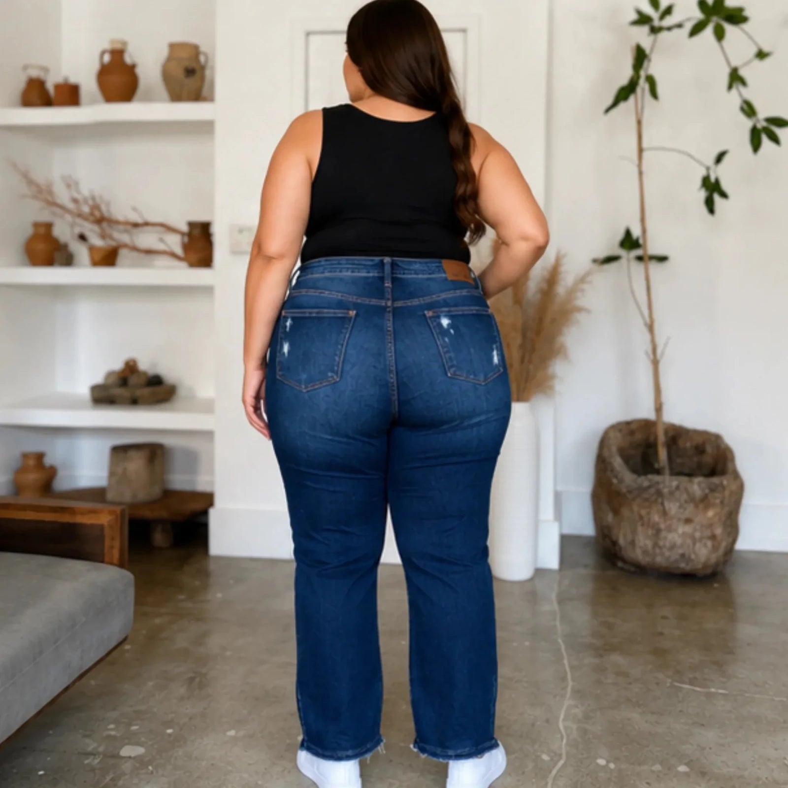 Plus-size model wearing Judy Blue High Waist Rigid Magic Heavy Destroy Straight Jeans back view highlighting the classic five-pocket design, premium fit, and distressed details.