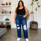 Plus-size model wearing Judy Blue High Waist Rigid Magic Heavy Destroy Straight Jeans front view featuring a dark wash, distressed knees, high-rise fit, and straight-leg silhouette.