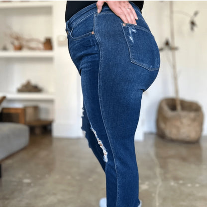 Lifestyle view of a person wearing Judy Blue distressed straight jeans.