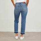 Back view of Judy Blue Full Size Mid Rise Rigid Magic Release Hem Jeans highlighting the flattering rear fit, pockets, and release hem finish.