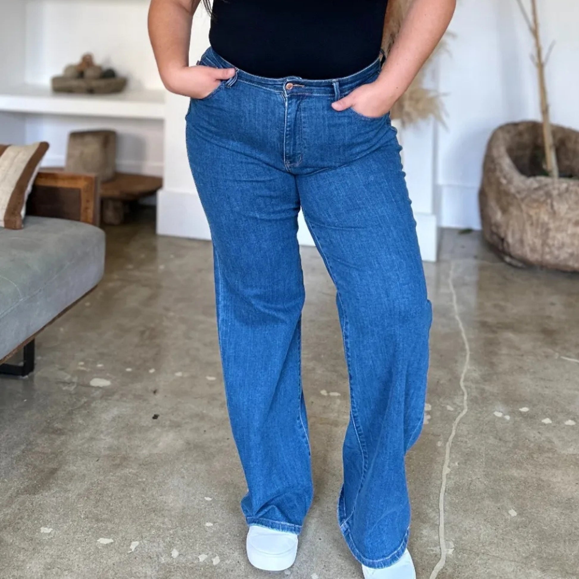 Model wearing Judy Blue high-rise straight-leg jeans in medium wash.