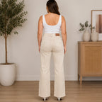 Women's Judy Blue High Waist Distressed Wide Leg Jeans in ivory back view featuring signature Judy Blue back pockets, high-rise waist, wide-leg fit, and premium stretch denim.