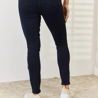 Final model presentation of the navy tummy control skinny jeans.