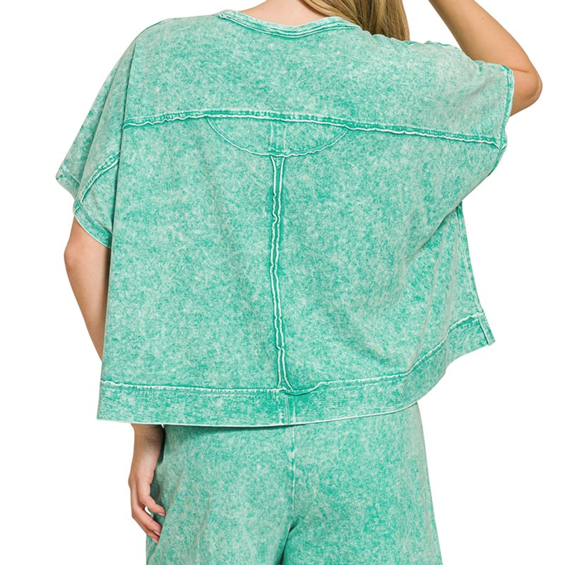Detailed view of the vintage snow-wash finish and pocket on the green Zenana set.