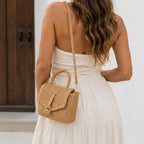 Back view of the Khaki Faux Straw Weaved Clutch Bag with an adjustable crossbody strap.