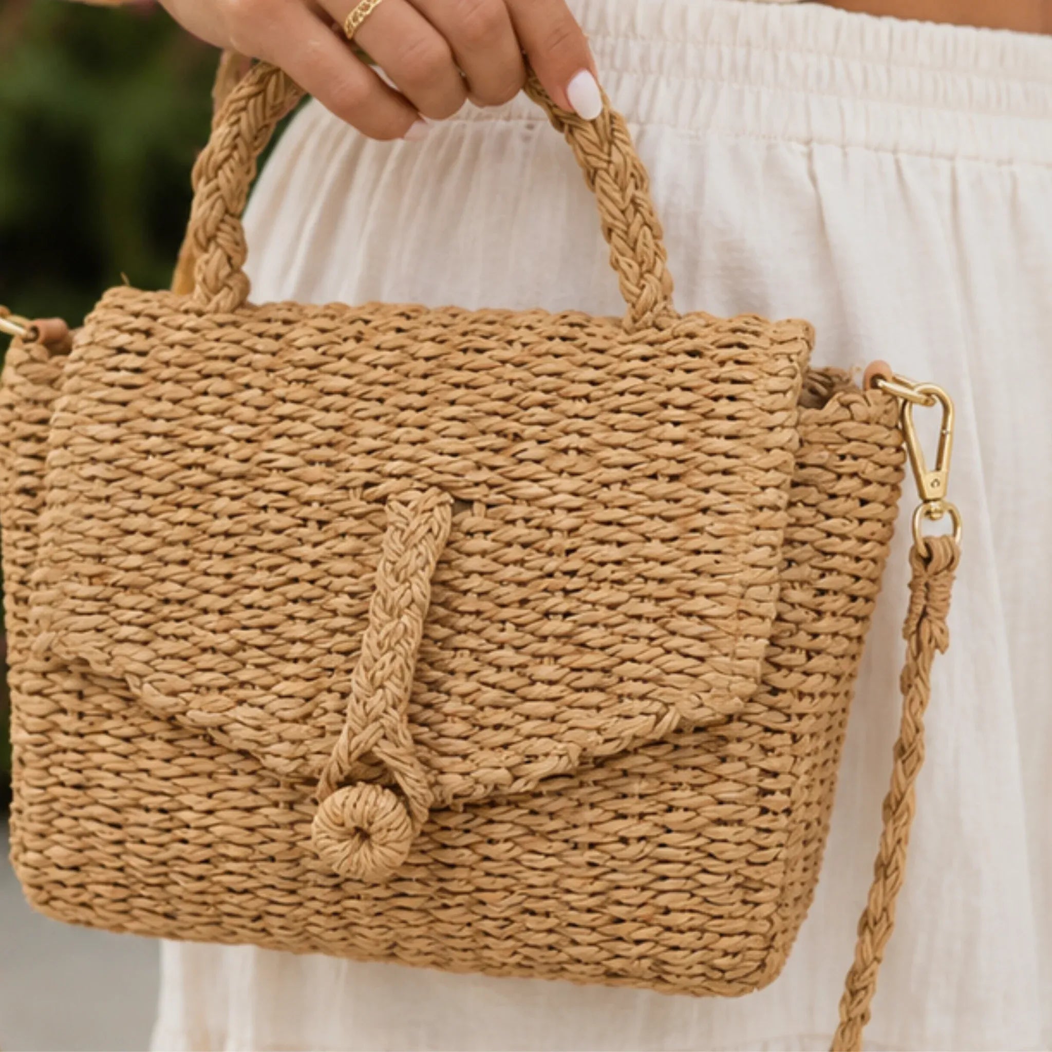 Close-up of the Khaki Faux Straw Weaved Clutch Bag showcasing its woven texture and flap closure.