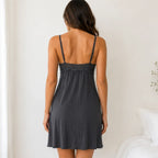 Back view of the graphite lace trim sleep chemise featuring adjustable straps, floral lace back detail, and a lightweight flowing fit.