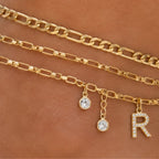 Close-up of the Layered Initial Gold Anklet featuring a sparkling letter charm, crystal accents, and polished gold chain details.