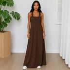 Woman wearing the Layered Sleeveless Maxi Dress Set in brown featuring a sleeveless layered design and maxi-length dress.