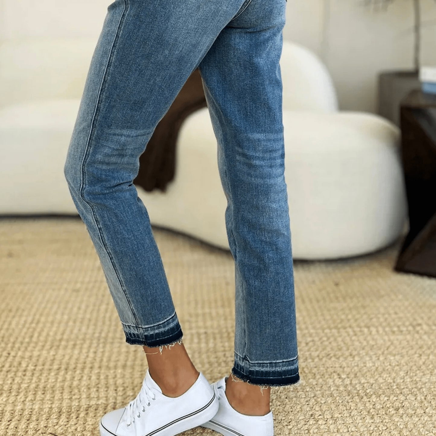 Lifestyle view of leg-rise rigid magic jeans for an everyday polished look.