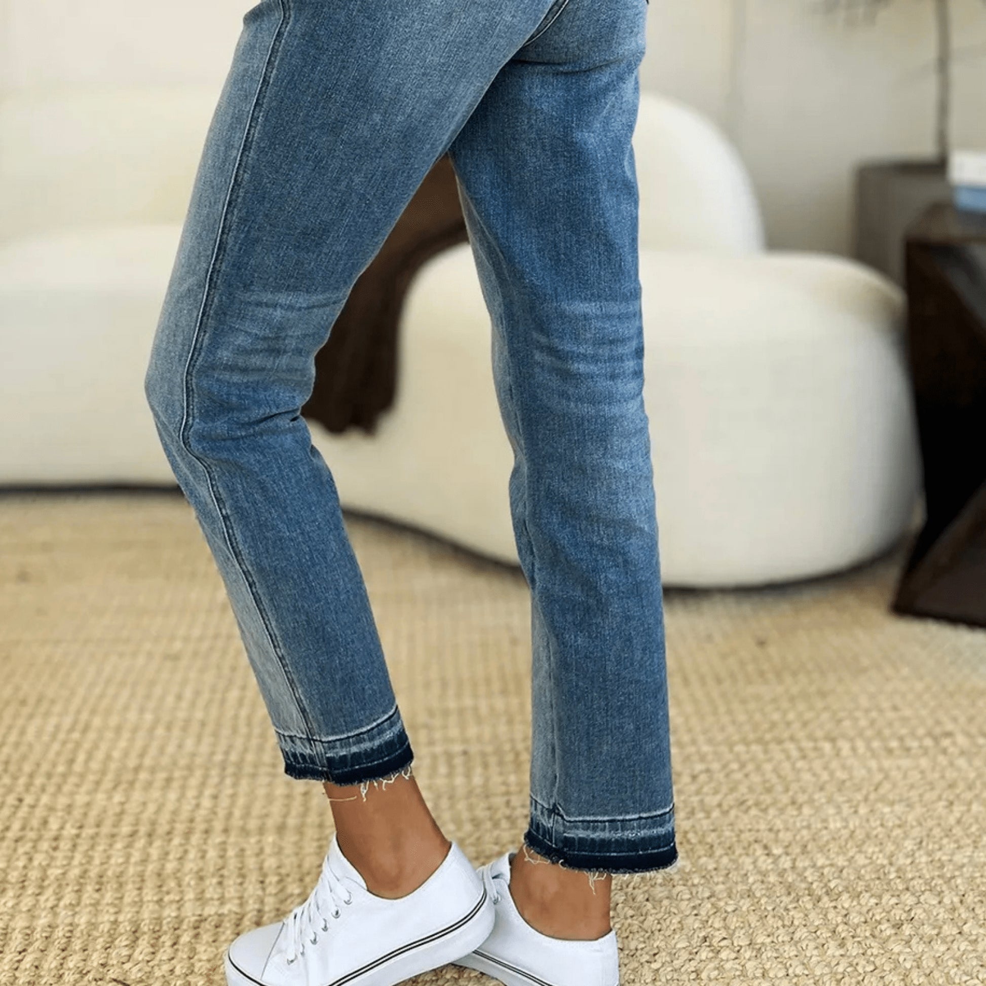 Lifestyle view of leg-rise rigid magic jeans for an everyday polished look.