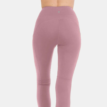 Lifestyle shot of a woman wearing Lunar Rock leggings for a modern, neutral boutique look.