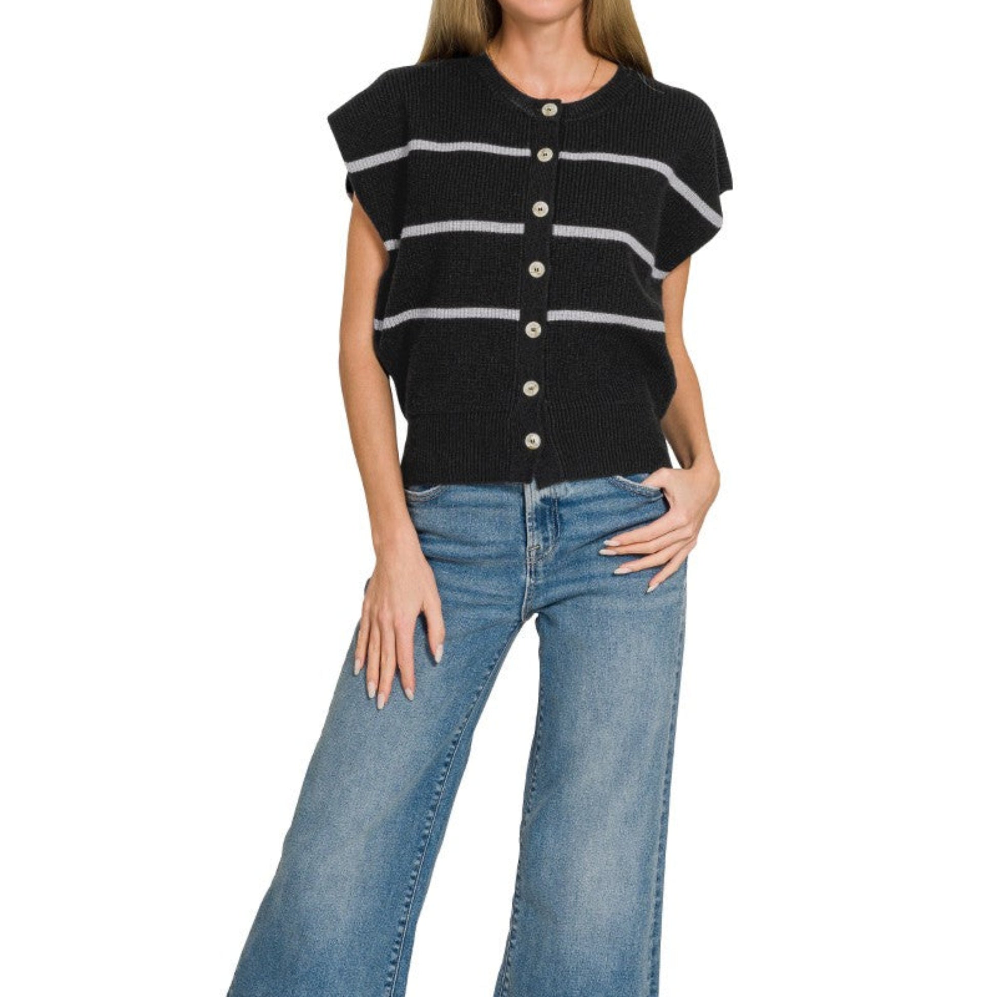 Lifestyle view of the Black striped sweater vest styled for a polished coastal look.