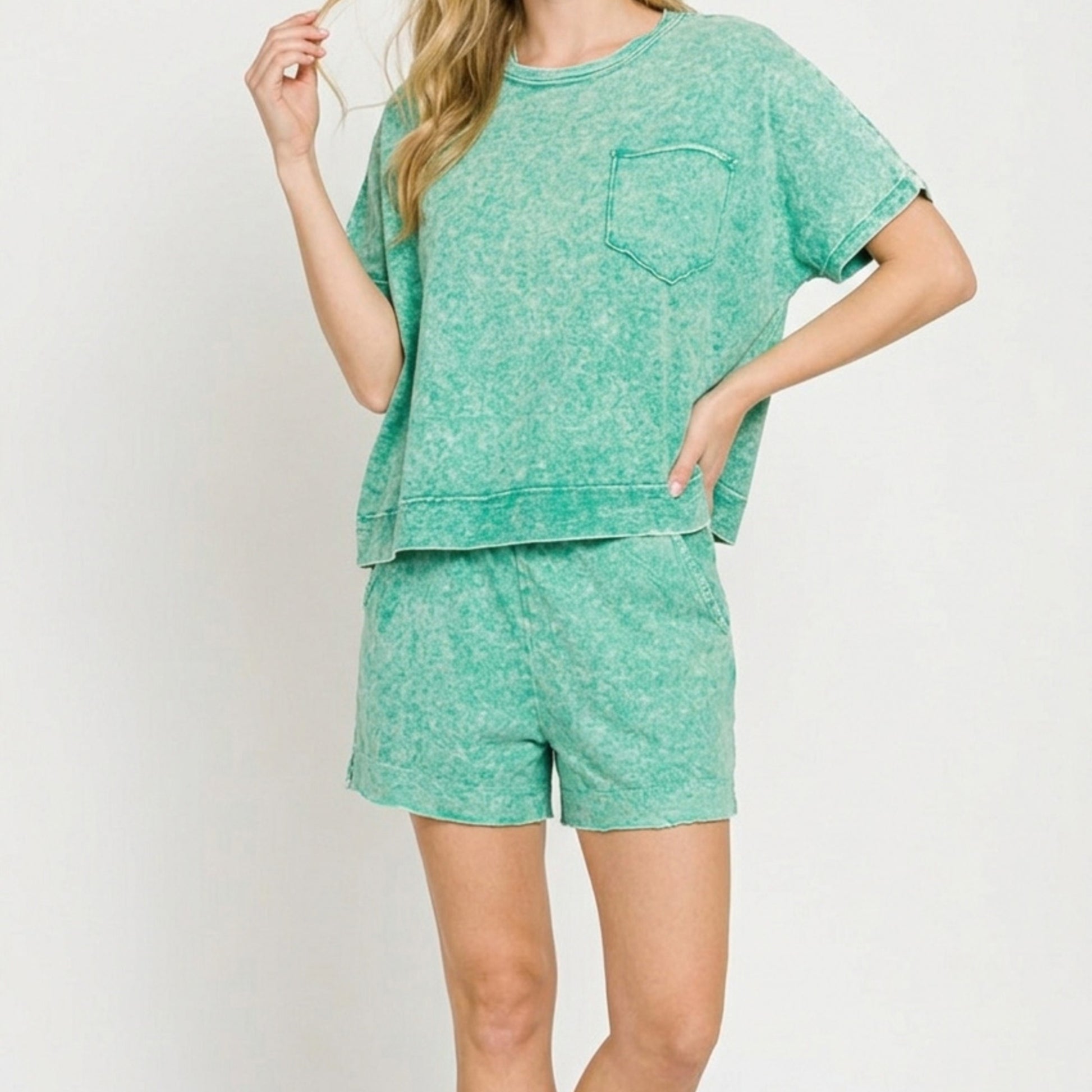 Lifestyle view of the Kelly green boxy top and shorts set showing the relaxed boutique fit.